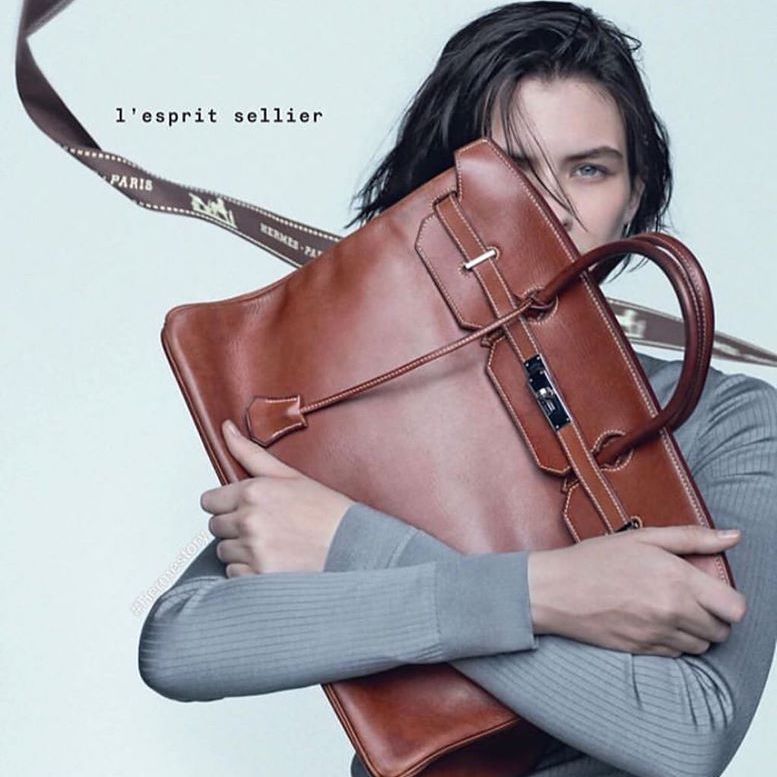 Paris, France - October, 3, 2021: Woman Wears Handbag Hermes Kelly